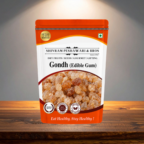 Gondh Edible Gum orange resealable pouch by Shivram Peshawari & Bros displayed on a wooden surface