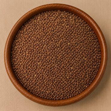 Raw halim garden cress seeds filling a round wooden bowl, top-down view