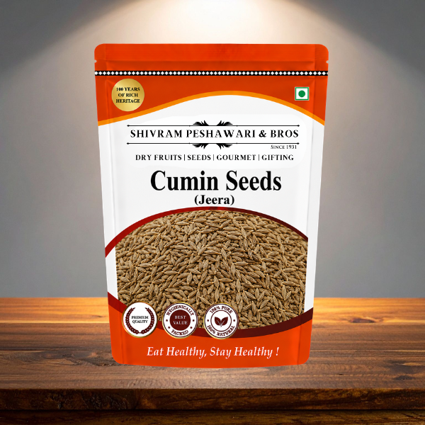 Shivram Peshawari & Bros Cumin Seeds (Jeera) standup pouch displayed on a wooden surface under spotlight