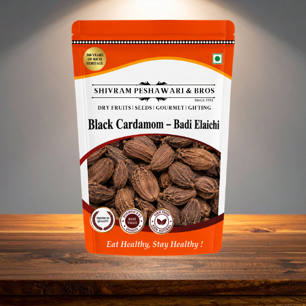 Shivram Peshawari & Bros Black Cardamom Badi Elaichi stand-up pouch displayed on a wooden surface with studio lighting