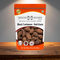 Shivram Peshawari & Bros Black Cardamom Badi Elaichi stand-up pouch displayed on a wooden surface with studio lighting