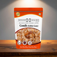 Gondh Edible Gum orange resealable pouch by Shivram Peshawari & Bros displayed on a wooden surface